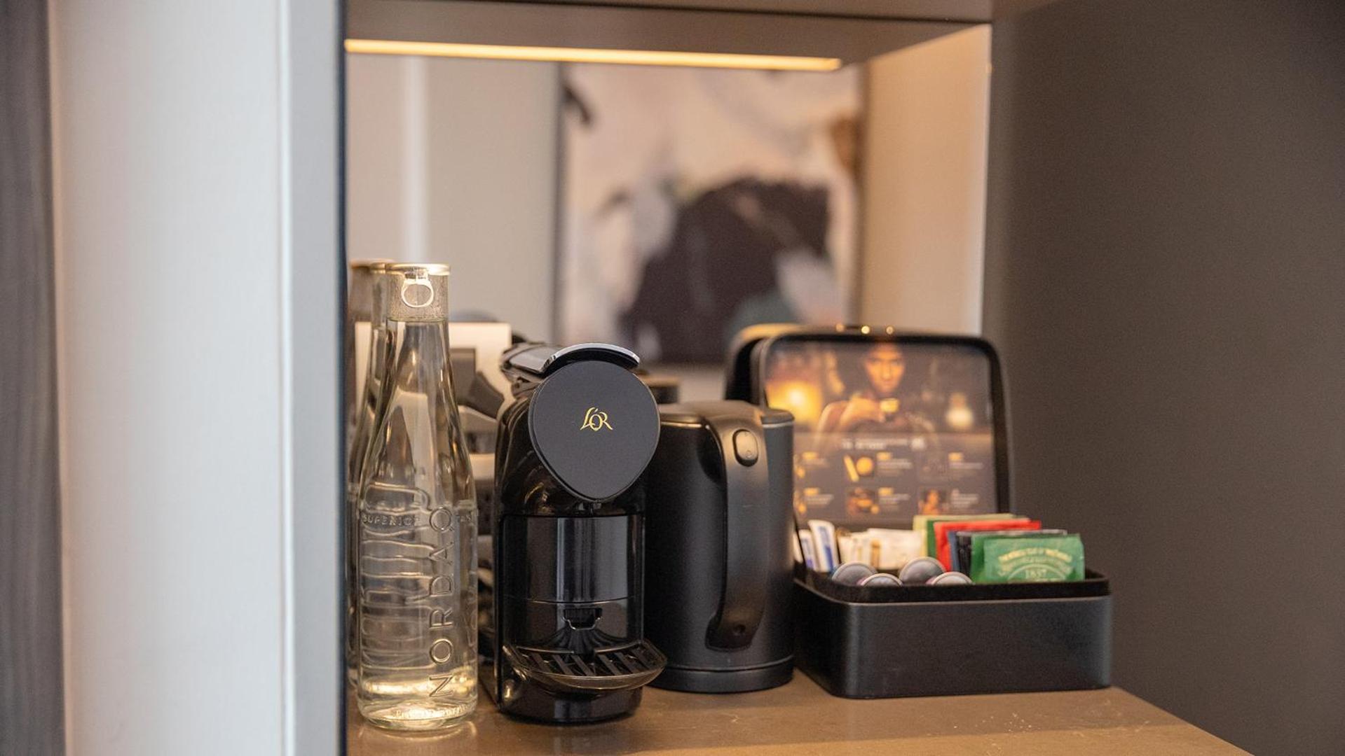 Chatrium Grand 방콕 외부 사진 A Nespresso coffee machine in a hotel room